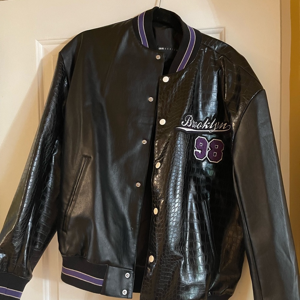 ASOS Design oversized spliced varsity jacket in black